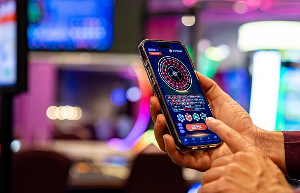 Jurassic Kingdom slot game interface on mobile phone showing reel layout and spin button